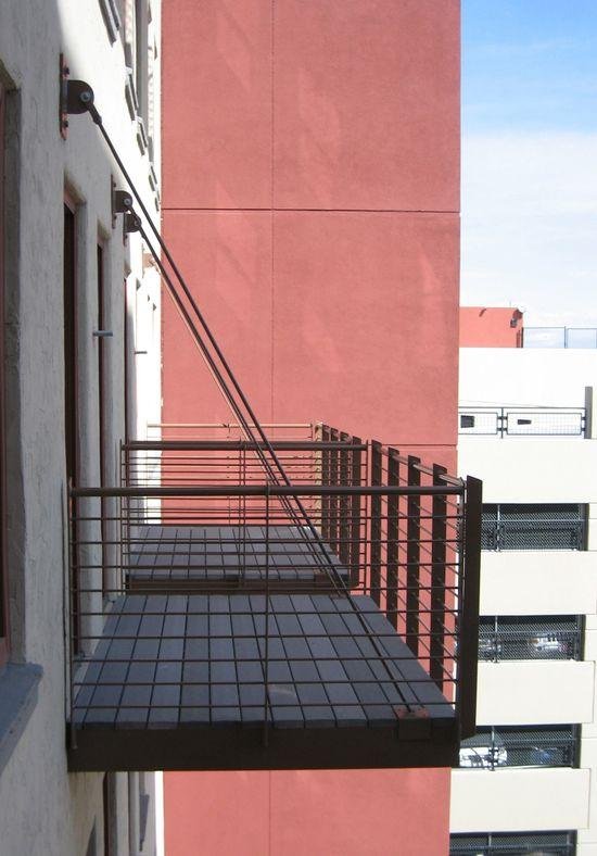 Photograph B: a projecting balcony connected to a wall and supported by diagonal stays
