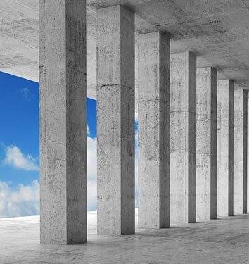 A row of vertical reinforced-concrete columns supporting a concrete slab